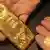 Gold coins and a gold bar