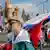 Юноша с российским флагом на Красной площади