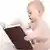 Symbolbild Baby mit Buch lesen vorlesen