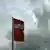 The SPD flag amid a background of dark clouds