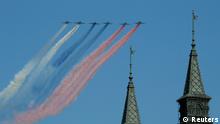 Russian military aircraft trail smoke in the colours of the Russian tricolor above the Victory Day Parade in Moscow's Red Square May 9, 2014. Russia celebrates the 1945 victory over Nazi Germany during World War Two on May 9. REUTERS/Sergei Karpukhin (RUSSIA - Tags: POLITICS MILITARY ANNIVERSARY CONFLICT)