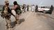 British soldiers on sentry duty from 29 Commando Regiment Royal Artillery stop and search a civilian vehicle at a road block near the Iraqi military stronghold of Abu al Khasib outside Basra in southern Iraq, March 31, 2003. Britons' backing for the war against Iraq has fallen for the first time since the conflict began, an opinion poll published on Monday found. Foto: Stephen Hird dpa (Pool) British soldiers on sentry duty from 29 Commando Regiment Royal Artillery stop and search a civilian vehicle at a road block near the Iraqi military stronghold of Abu al Khasib outside Basra in southern Iraq, March 31, 2003. Britons' backing for the war against Iraq has fallen for the first time since the conflict began, an opinion poll published on Monday found. Foto: Stephen Hird dpa (Pool)