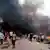Rauchwolken liegen nach zwei Bombenanschlägen über einem Markt der nigerianischen Stadt Jos (Foto: AP).