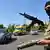An armed pro-Russian militant checks passing cars near the eastern Ukrainian city of Kramatorsk on May 20, 2014. AFP VIKTOR DRACHEV/AFP/Getty Images