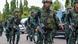 Thai soldiers run as they take their positions during a coup at the Army Club where Thailand's army chief held a meeting with all rival factions in central Bangkok May 22, 2014. Thai soldiers run as they take their positions during a coup at the Army Club where Thailand's army chief held a meeting with all rival factions in central Bangkok May 22, 2014.
