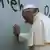 Pope Francis prays while placing his hand on the wall separating the West Bank from Israel