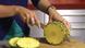 A pineapple being sliced A pineapple being sliced
