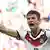 Thomas Müller celebrating scoring a goal at this year's World Cup