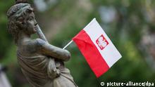 A Polish flag decorates a sculpture in Sopot, Poland, 16 June 2012. The EURO 2012 runs from 08 June till 01 July and takes place in Poland and the Ukraine. Photo: Jens Wolf dpa +++(c) dpa - Bildfunk+++