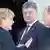 Putin und Petro Poroschenko - BENOUVILLE, FRANCE - JUNE 06: (L-R) German Chancellor Angela Merkel, Petro Poroshenko and Russian President Vladimir Putin are seen after their lunch on June 6, 2014 in Benouville, France. Friday 6th June is the 70th anniversary of the D-Day landings which saw 156,000 troops from the allied countries including the United Kingdom and the United States join forces to launch an audacious attack on the beaches of Normandy, these assaults are credited with the eventual defeat of Nazi Germany. A series of events commemorating the 70th anniversary are planned for the week with many heads of state travelling to the famous beaches to pay their respects to those who lost their lives. (Photo by Guido Bergmann/Bundesregierung via Getty Images)