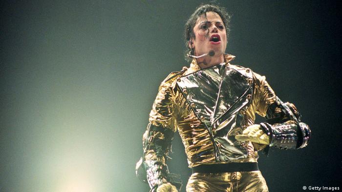 Michael Jackson sings in a golden suit