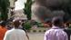 People watch as smoke fills the sky, after an explosion, at a shopping mall, Wednesday, June 25, 2014, in Abuja, Nigeria. An explosion rocked a shopping mall in Nigeria's capital, Abuja, on Wednesday and police say at least over 20 people have been killed and many wounded. Witnesses say body parts were scattered around the exit to Emab Plaza, in the upscale Wuse 11 suburb. (AP Photo) People watch as smoke fills the sky, after an explosion, at a shopping mall, Wednesday, June 25, 2014, in Abuja, Nigeria. An explosion rocked a shopping mall in Nigeria's capital, Abuja, on Wednesday and police say at least over 20 people have been killed and many wounded. Witnesses say body parts were scattered around the exit to Emab Plaza, in the upscale Wuse 11 suburb. (AP Photo)