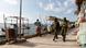 Kenya police officers patrol along the beaches of the Indian Ocean in the coastal town of Lamu, June 19, 2014. The latest in a string of militant attacks on Kenya's coast has dealt a fresh blow to the economy, but the threat this time goes beyond the tourist trade to an ambitious $25.5 billion port and transport scheme next to the historic town of Lamu. To match story - KENYA-ATTACKS/ECONOMY. Picture taken June 19, 2014. REUTERS/Thomas Mukoya Kenya police officers patrol along the beaches of the Indian Ocean in the coastal town of Lamu, June 19, 2014. The latest in a string of militant attacks on Kenya's coast has dealt a fresh blow to the economy, but the threat this time goes beyond the tourist trade to an ambitious $25.5 billion port and transport scheme next to the historic town of Lamu. To match story - KENYA-ATTACKS/ECONOMY. Picture taken June 19, 2014. REUTERS/Thomas Mukoya