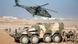 A German Bundeswehr NH90 helicopter flies past a Boxer armoured fighting vehicle . A German Bundeswehr NH90 helicopter flies past a Boxer armoured fighting vehicle .