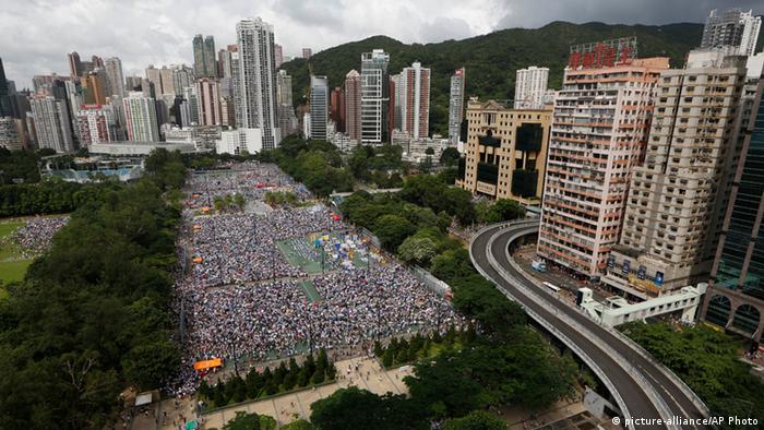 Tens of thousands of residents gather to march in downtown streets during an annual pro-democracy protest in Hong Kong Tuesday, July 1, 2014 (Photo: AP Photo/Kin Cheung)