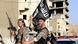 Militant Islamist fighters wave flags as they take part in a military parade along the streets of Syria's northern Raqqa province June 30, 2014. The fighters held the parade to celebrate their declaration of an Islamic "caliphate" after the group captured territory in neighbouring Iraq, a monitoring service said. The Islamic State, an al Qaeda offshoot previously known as Islamic State in Iraq and the Levant (ISIL), posted pictures online on Sunday of people waving black flags from cars and holding guns in the air, the SITE monitoring service said. Picture taken June 30, 2014. REUTERS/Stringer Militant Islamist fighters wave flags as they take part in a military parade along the streets of Syria's northern Raqqa province June 30, 2014. The fighters held the parade to celebrate their declaration of an Islamic "caliphate" after the group captured territory in neighbouring Iraq, a monitoring service said. The Islamic State, an al Qaeda offshoot previously known as Islamic State in Iraq and the Levant (ISIL), posted pictures online on Sunday of people waving black flags from cars and holding guns in the air, the SITE monitoring service said. Picture taken June 30, 2014. REUTERS/Stringer