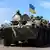 Украинские солдаты едут на танке недалеко от города Славянск