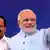 Indian Prime Minister Narendra Modi (R) waves to the gathering as railway minister D. V. Sadananda Gowda (L) stands next to him during the inaugural function of the first train Shree Shakti Express, from Udhampur to Katra railway station, about 45 KM from Jammu, the winter capital of Kashmir, India, 04 July 2014.