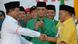 Indonesian presidential candidate Prabowo Subianto (L) shakes hands with Aburizal Bakrie (R), head of Golkar Party, as Suryadharma Ali (C), chairman of United Development Party, looks on after the declaration of a permanent coalition in Jakarta on July 14, 2014. Indonesian presidential candidate Prabowo Subianto (L) shakes hands with Aburizal Bakrie (R), head of Golkar Party, as Suryadharma Ali (C), chairman of United Development Party, looks on after the declaration of a permanent coalition in Jakarta on July 14, 2014.