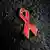 Red ribbon, symbolizing the fight against AIDS. Photo: dpa - Bildfunk
