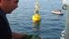A technician helps install a buoy which will be part of a tsunami warning system developed by GITEWS A technician helps install a buoy which will be part of a tsunami warning system developed by GITEWS