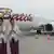 Two Indonesian air hostess stand next to a Boeing 737-900 plane of the new Indonesian airline Batik Air, a subsidiary of Lion Air is parked at the Soekarno-Hatta airport during the launching ceremony in Tangerang in the outskirt of Jakarta on April 25, 2013 (Photo: BERRY/AFP/Getty Images)