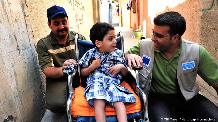 A young boy in a wheelchair