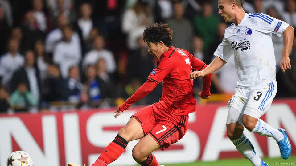 Leverkusen, Germany, 1st October, 2014. UEFA Champions League 2014/2015  Group stage Group C matchday 2, Bayer 04 Leverkusen (red) - Benfica  Lissabon (black) --- Heung-Min Son (Leverkusen) and Stefan Kie§ling  (Kiessling) (Leverkusen)