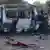 Бійці "Донбасу" інспектують спалений мікроавтобус біля Іловайська