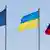 Symbolic image showing the EU, Ukrainian and Russian flags.