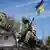 Военные на БМП под украинским флагом