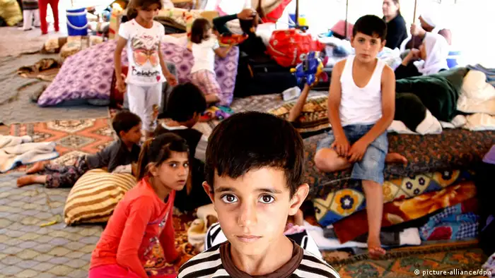 Kinder in einem Flüchtlingslager in Silopi an der türkisch-irakischen Grenze (Foto: EPA)