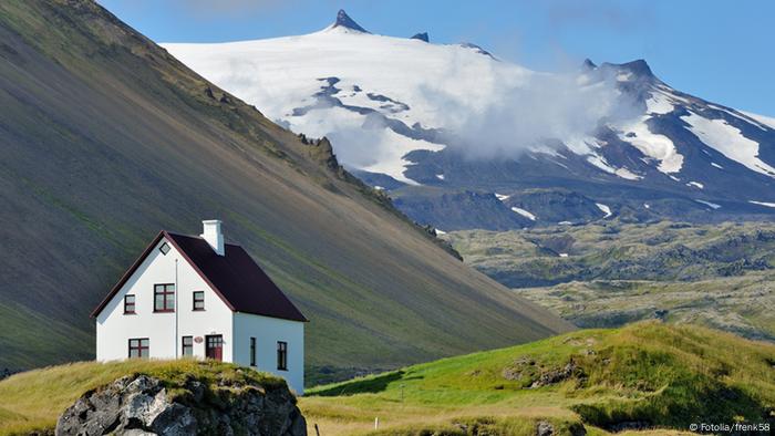 A home in Iceland with a volcano in the background