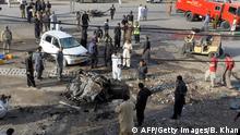 Pakistani security officials examine the site of a bomb explosion in Quetta on September 13, 2014. A bomb explosion on a busy road Saturday killed two and wounded at least 17 people including two paramilitary soldiers in Pakistan's southwestern Baluchistan province, security officials said. AFP PHOTO/ BANARAS KHAN (Photo credit should read BANARAS KHAN/AFP/Getty Images)