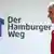 Fußball - HSV Trainer Mirko Slomka geht an einer Werbung "Der Hamburger Weg" vorbei (Foto: dpa)