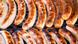 Sausages being cooked on a barbeque Sausages being cooked on a barbeque