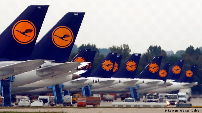Lufthansa aircraft sitting parked on a tarmac