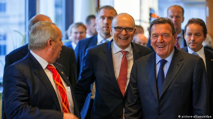 Erwin Sellering, governor of Mecklenburg next to former Chancellor Gerhard Schröder