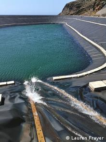 Water flows into a sea-level artificial lake, after passing through turbines to generate electricity (Photo: Lauren Frayer/DW)