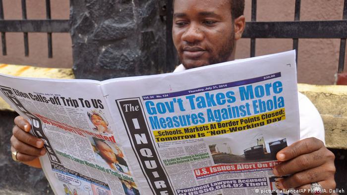 A man reads a newspaper