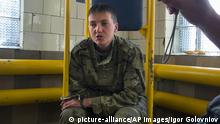 FILE - In this Thursday, June 19, 2014 file photo, Ukrainian army officer Nadezhda Savchenko, 33, speaks to journalists shortly after her capture in Luhansk, Ukraine. Russia’s Investigative Committee said in a statement on Wednesday, July 9, 2014, that Nadezhda Savchenko is suspected of tipping off the Ukrainian army of the whereabouts of the journalists. The two men were killed immediately after that, the investigators claim. Ukraine has raised the alarm about the disappearance of the Ukrainian pilot. Moscow insisted that Savchenko crossed the border on her own volition. (AP Photo/Igor Golovniov, File)