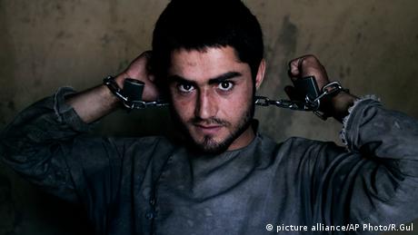 Amanullah, a drug addict, is chained to a wall during his 40-day incarceration at the Mia Ali Baba shrine in Jalalabad, Afghanistan (Photo: AP Photo/Rahmat Gul, File)