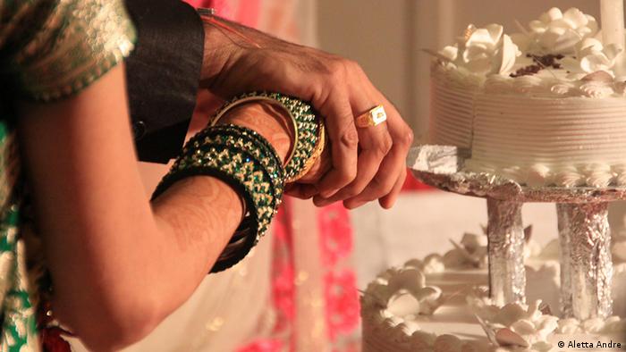 Indian couple cut a wedding cake
