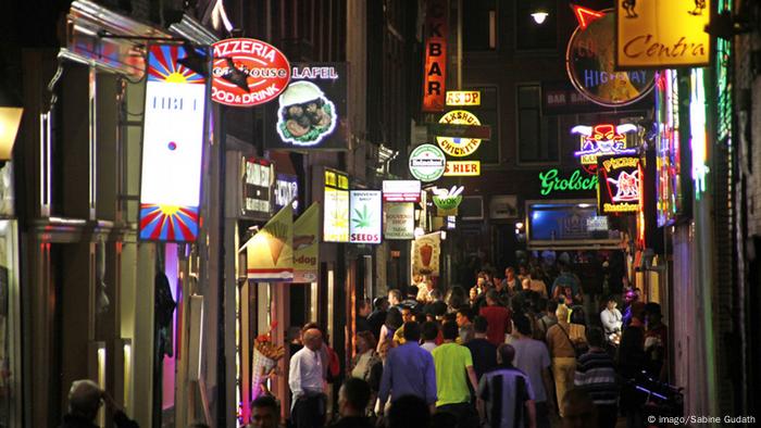 A busy Amsterdam street with bars