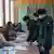 Ukrainian soldiers pictured in a polling station