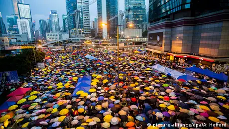 A sea of multicoloured umbrellas, which the protestors used for protection 