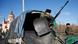 Pro-Russian separatists guard their positions on a street in Makiivka, outside Donetsk Pro-Russian separatists guard their positions on a street in Makiivka, outside Donetsk