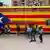 A bus painted as the Catalan flag. (Photo: REUTERS/Albert Gea)