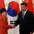 China's President Xi Jinping (R) shakes hands with South Korea's President Park Geun-hye in front of Chinese and South Korean national flags during a meeting at the Great Hall of the People, on the sidelines of the Asia Pacific Economic Cooperation (APEC) meetings, November 10, 2014 in Beijing, China (Photo: Kim Kyung-Hoon-Pool/Getty Images)