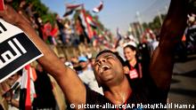 FILE - In this Wednesday, July 3, 2013 file photo, an opponent of Egypt's Islamist President Mohammed Morsi chants slogans during a protest outside the presidential palace, in Cairo, Egypt. Almost a quarter-century ago, a young American political scientist achieved global academic celebrity by proclaiming that the collapse of communism had ended the discussion on how to run societies, leaving Western liberal democracy as the final form of human government. In Egypt and around the Middle East, after a summer of violence and upheaval, the discussion, however, is still going strong. And almost three years into the Arab Spring revolts, profound uncertainties remain. (AP Photo/Khalil Hamra, File)